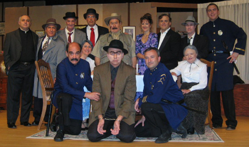 Entire cast of fourteen posing in three rows